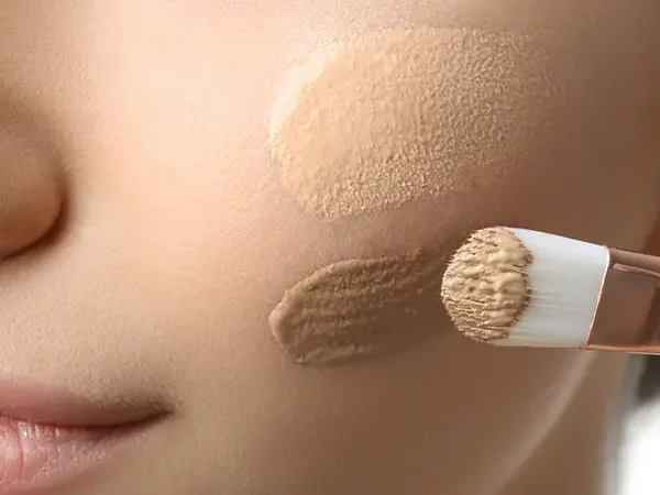 applying foundation on the face